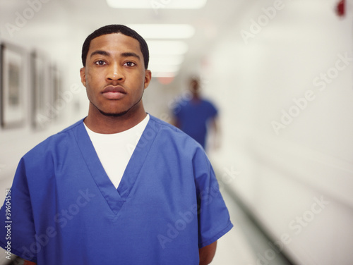 Photo: Young male doctor in hallway Young male doctor in hallway