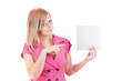 Photo: Young woman pointing at blank card in her hand Young woman pointing at blank card in her hand
