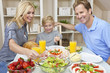 Parents Child Family Healthy Food & Salad At Dining Table