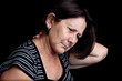 Woman suffering from neck or shoulder pain