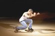 Young man performing dance on roller skates