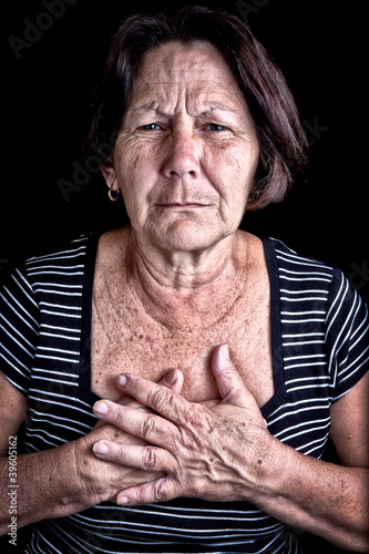 Photo: Mature woman suffering from chest pain Mature woman suffering from chest pain