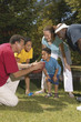 Family in football huddle