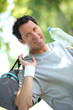 Sporty looking man drinking from a large bottle of water