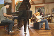 Men playing guitar and piano