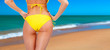 Closeup of a female backside in a yellow swimsuit Closeup of a female backside in a yellow swimsuit
