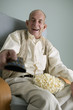 Elderly man watching television