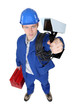 Tradesman holding a surveillance camera