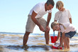 Family playing in the sea
