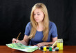 Painter at desk.