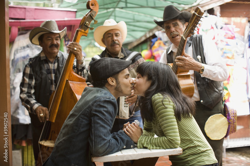 Photo: Young couple with Mariachi band Young couple with Mariachi band