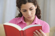 Young woman reading a book