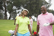 Two couples play golf together