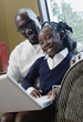 Man and girl with laptop computer