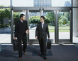 Businessmen entering building