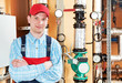 heating engineer repairman in boiler room