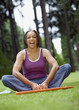 Senior woman stretching in park