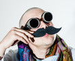 Man fiddles his false moustache