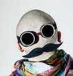 Back of a shaved head dressed as a face