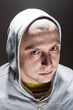 Portrait of a bold man in a hoodie