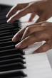 Close up of hands playing piano