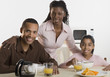 Portrait of family at breakfast table