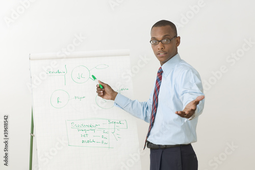 Photo: Portrait of male businessman giving presentation Portrait of male businessman giving presentation