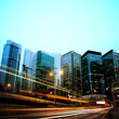 moving car with blur light through city at night