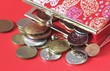 Red purse with coins