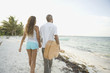 Young couple walking on the beach