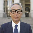 Senior Asian businessman posing