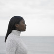 Young woman's profile with ocean in the background