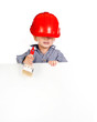 little boy with a brush in the helmet with banner
