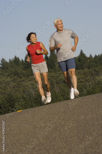 Photo: Senior couple jogging together Senior couple jogging together