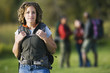 Young backpacker smiling for the camera outdoors