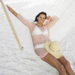 Young woman relaxing in a hammock
