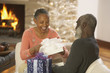 Senior African couple opening presents
