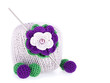 Ball of cotton yarn with knitted flower and beads on the white