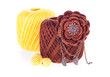 Balls of cotton knitting yarn with brooch and beads on the white