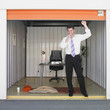 Businessman getting ready to sleep in storage unit office