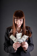 Photo: Laughing business woman with dollars Laughing business woman with dollars
