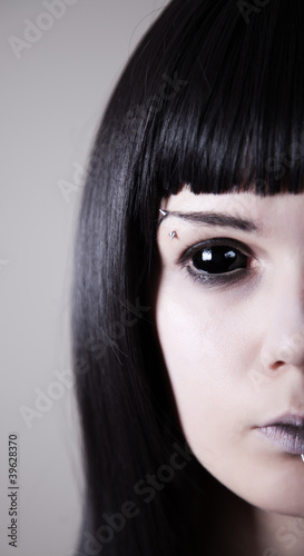 Photo: Spooky black eyed woman with pale skin Spooky black eyed woman with pale skin