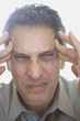 Businessman rubbing his temples