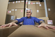 Frustrated businessman in warehouse