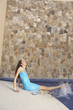 Woman kicking her feet in hotel pool