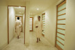 Men in robes walking in a spa hallway
