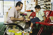 Young Hispanic boy trying shoes at shoe store
