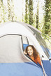 African American girl peeking out of tent