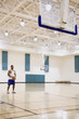 Man with basketball on court