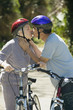 Senior couple kissing with bicycles